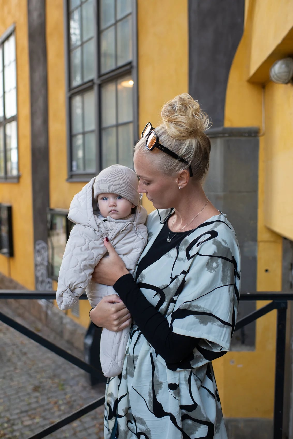 Family wearing 2CC prints on a Norrköping street